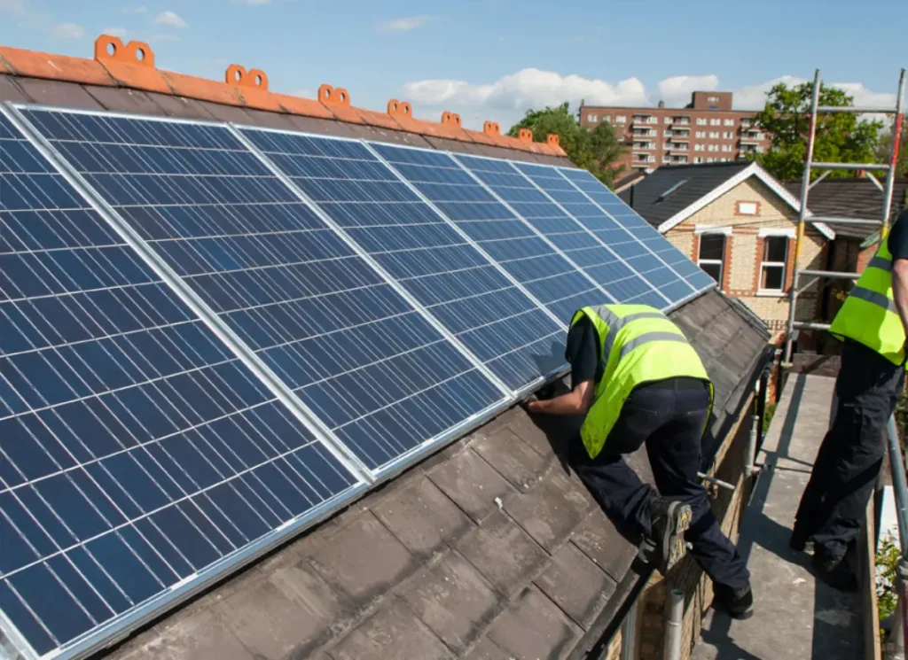 Workers securing roof panels